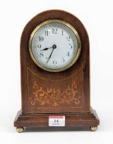 *An Edwardian mahogany and inlaid dome top mantel clock, the enamel dial with Arabic numerals,