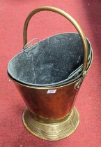 A 19th century brass coal bucket, having hinged carry handle and tin liner, h.52cm; together with an