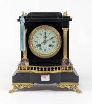 *A 19th century French black slate cased mantel clock of architectural form, the sectional white
