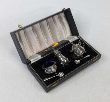 A George V silver three-piece cruet, comprising mustard, open salt and pepperette, with salt and