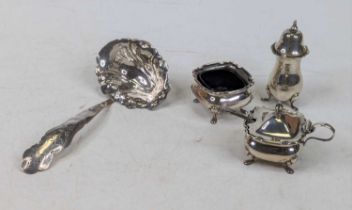 A George V silver part cruet set, comprising mustard with blue glass liner, and an open salt;