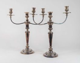 A pair of late 19th century Old Sheffield plate three branch table candelabra, height 46cm