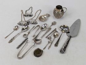 A small quantity of assorted silver items, to include a Victorian repousse decorated cream jug by