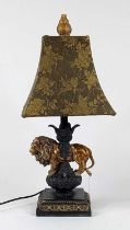 *A painted composite table lamp having a gilt acanthus finial over floral embroidered shade, the