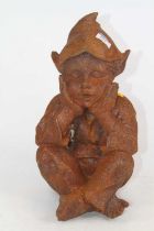 A rusted metal model of a seated pixie, h.35cm