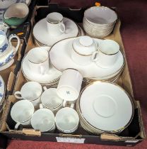 A collection of Thomas German white glazed tableware, having gilt rims, to include teacups, bowls,