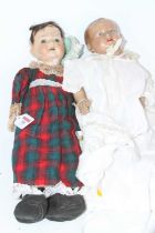 A vintage German wax headed doll, h.42cm; together with a celluloid example (2)
