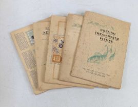 A collection of vintage cigarette cards, housed in albums