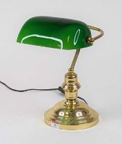 An early 20th century style banker's desk lamp having a green glass shade on a brass base, height