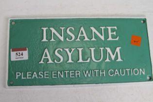 A cast iron sign inscribed 'Insane Asylum', 27 x 13cm