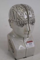 A pair of pottery book-ends, each in the form of a phrenology head, h.21cm