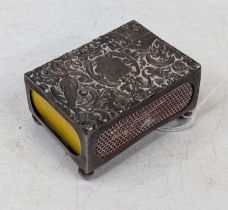 A Victorian silver matchbox case, repousse decorated with birds amongst leaves and scrolls,