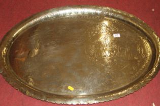 An Indian polished brass tray, etched with a hunting scene, 54 x 78cm