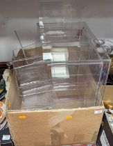 A collection of perspex display stands of varying sizes