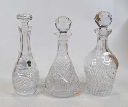 A Waterford Crystal decanter and stopper, h.28cm; together with two Tyrone crystal decanters and
