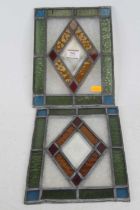 *A pair of early 20th century stained glass panels, 26 x 19cm