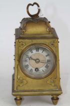 A 19th century brass mantel clock, the silvered dial showing Roman numerals Runs when started but we