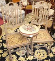 A pair of early 20th century limed carved oak barley twist cane seat dining chairs, together with