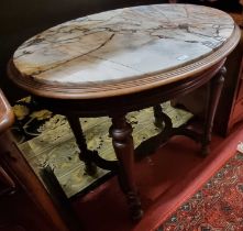 A late 19th century French walnut and variegated marble inset oval side table, raised on turned
