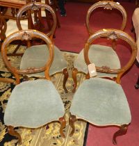 A set of four mid-Victorian walnut balloon back salon side chairs, each having dralon upholstered