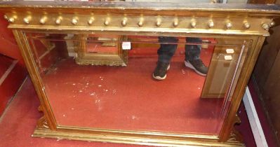 Late Victorian gilt wood and gesso over mantel mirror having a ball applied frieze above a