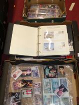 Four boxes containing TV related accessories to include 007 cards, Elvis Presley TVmagnets, First