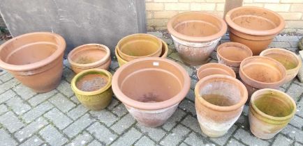 A set of four contemporary cylindrical tapering terracotta planters, together with sundry further