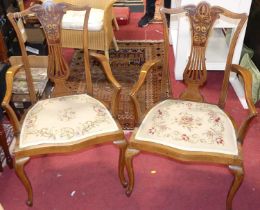 *A pair of Edwardian mahogany floral satin wood inlaid and further strung salon elbow chairs, each