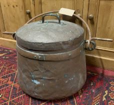A late 19th century copper circular cauldron and cover, with iron swing handle, h.43cm