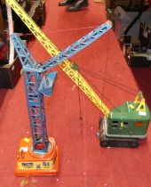 Two tin plate cranes