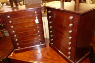 A pair of mahogany eight drawer table-top collector's chests, each with burnished brass turned