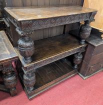 A joined and floral relief carved oak three-tier buffet, in the 17th century taste, each tier raised