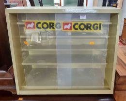 A painted wood Corgi Collectors' display table top cabinet, with twin perspex sliding doors and four