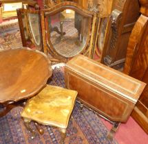 *An early 20th century mahogany shield shaped triptych dressing mirror; together with a mahogany