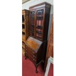 *An early 20th century mahogany bureau bookcase, width 72cm