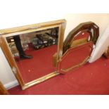 Two Art Deco style gilt decorated wall mirrors, each with marginal mirrorplates, the larger 95 x