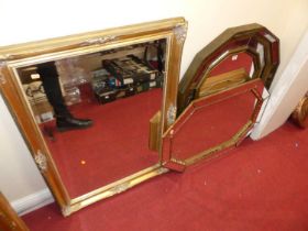 Two Art Deco style gilt decorated wall mirrors, each with marginal mirrorplates, the larger 95 x