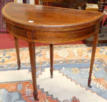 *An Edwardian mahogany and satinwood crossbanded D-shaped baize lined fold-over card table, having