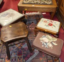 *Four various early 20th century upholstery topped footstools; together with a 19th century