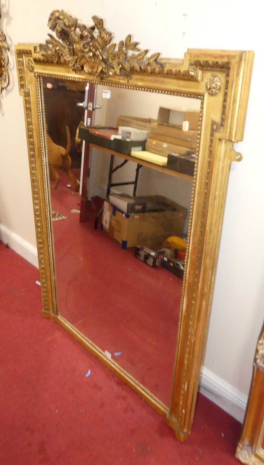 A 19th century French giltwood and gesso overmantel mirror, having proud corners, quiver of