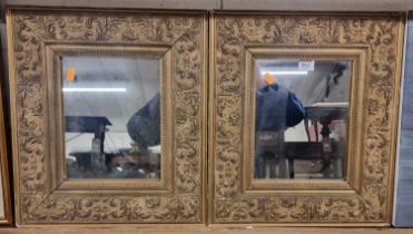 A pair of gilt composition framed rectangular wall mirrors, each 45 x 39cm