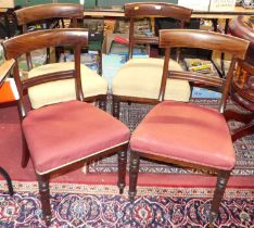 A set of four Regency mahogany bar back dining chairs, each with fabric upholstered stuff over seats