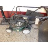 A Webb petrol driven lawnmower, with grass collecting box