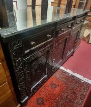 A 19th century floral relief carved oak sideboard, having a contemporary green variegated marble top