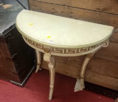 A cream painted and gilt decorated demi-lune side table, in the classical taste, width 76cm