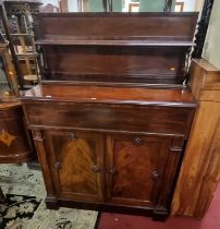 A George IV mahogany and flame mahogany chiffonier, having a raised superstructure, secretaire