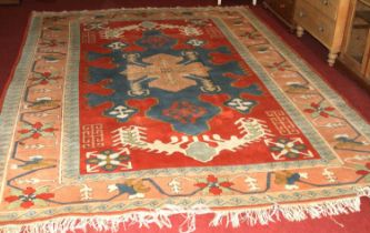 A Turkish woollen bright coloured rug, floral abstract decorated, hand-knotted, 325 x 240cm
