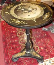 *A Victorian black lacquered, gilt decorated and mother of pearl inset papier-mache circular tilt-
