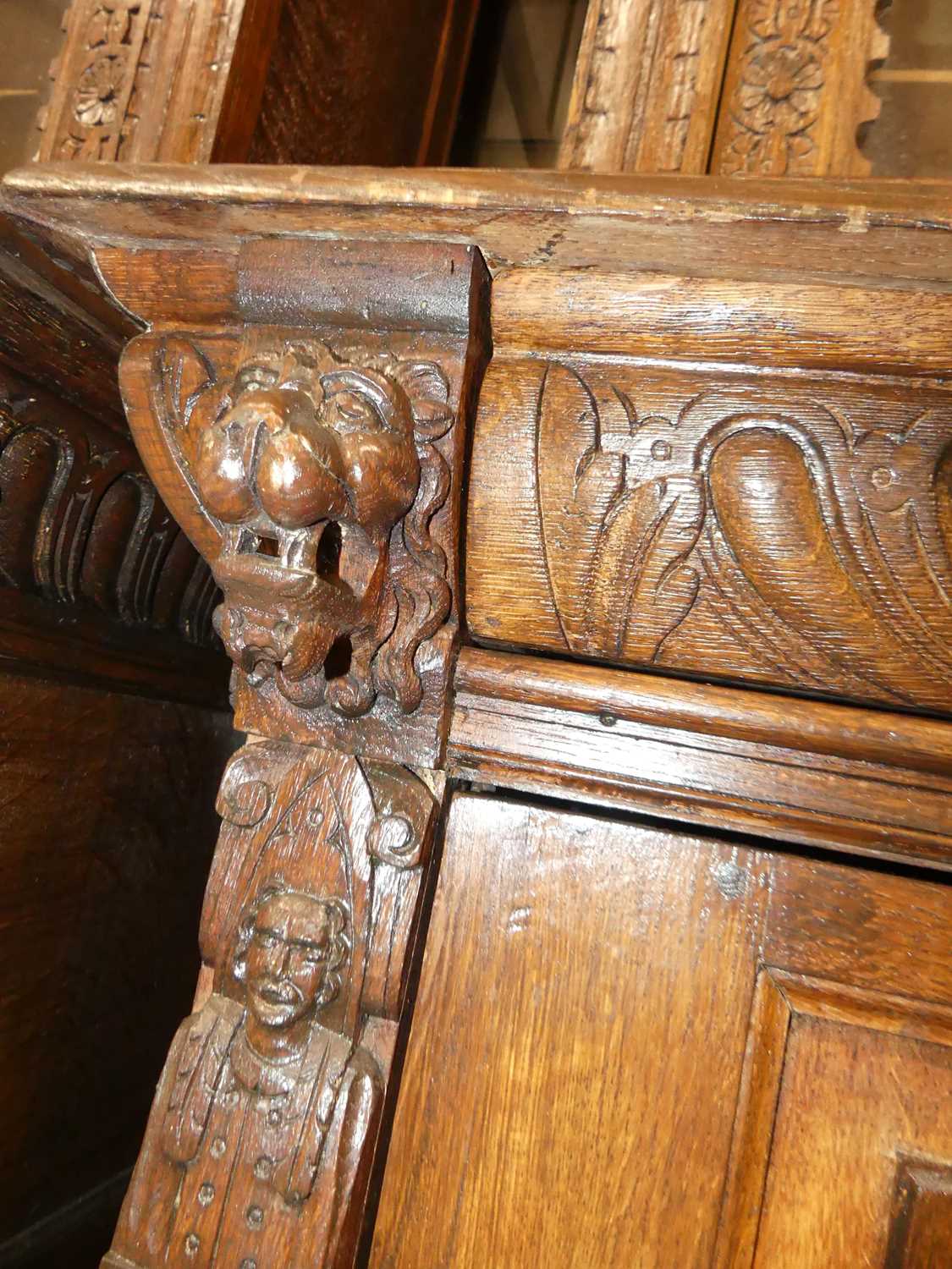 A pair of circa 1900 heavily carved Flemish oak parlour bookcases, each with single glazed upper - Image 7 of 10