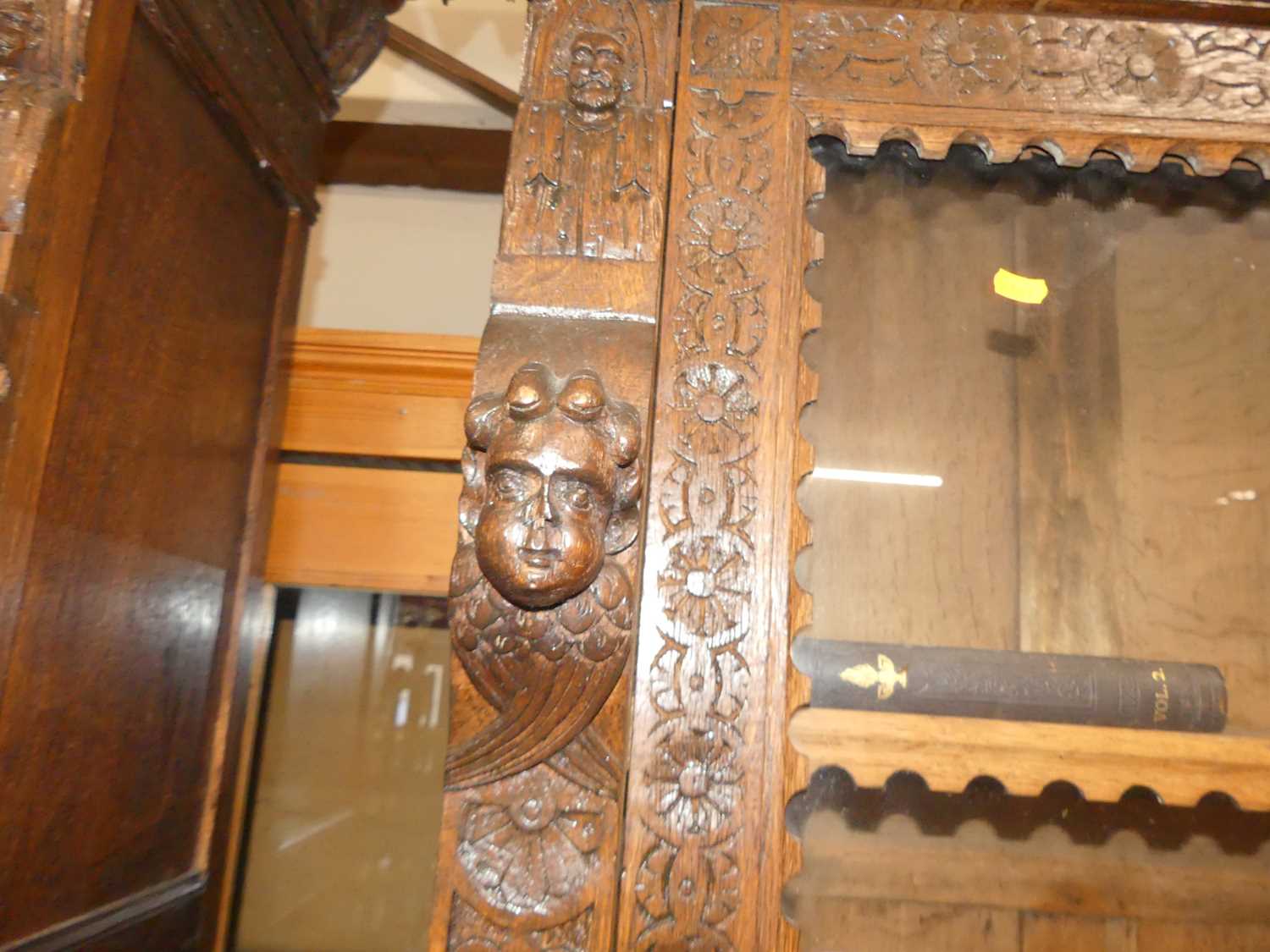 A pair of circa 1900 heavily carved Flemish oak parlour bookcases, each with single glazed upper - Image 8 of 10